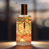 Horizon perfume from Wanderer Collection in a clear bottle at the sunset