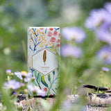 Luna perfume from Wanderer collection in a botanical print box in the woods