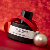 Midnight Madness from Nostalgia in red background and Christmas decor 