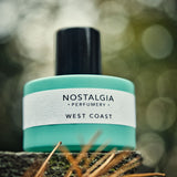 West Coast perfume blue bottle in the woods