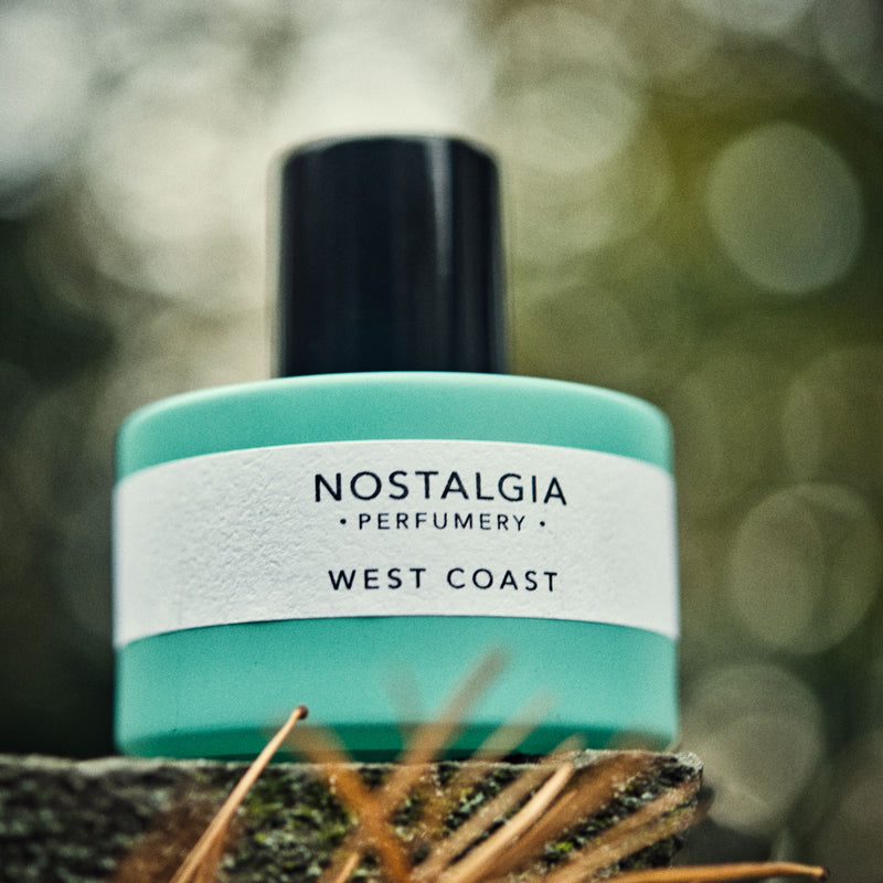 West Coast perfume blue bottle in the woods